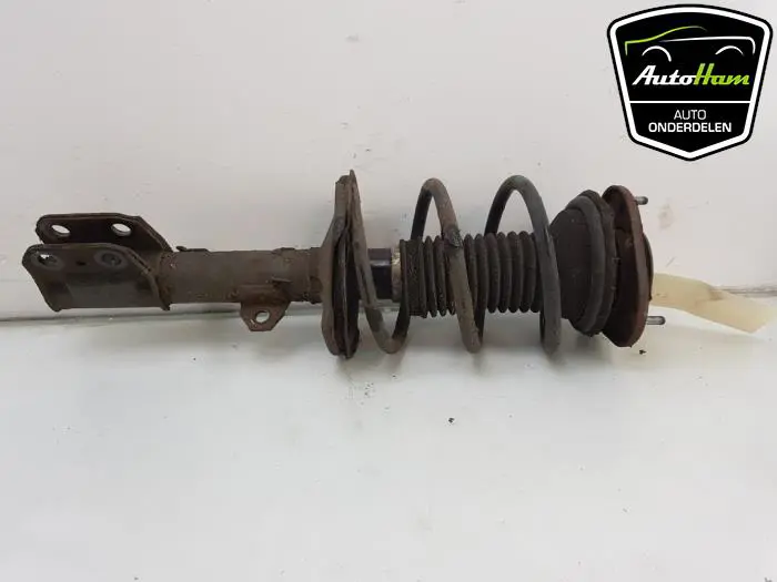 Schokdemper links-voor Toyota Avensis