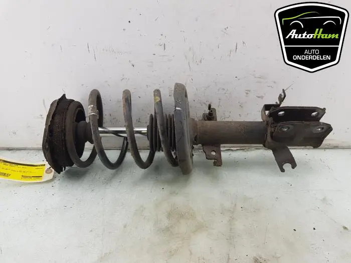 Schokdemper links-voor Renault Grand Scenic