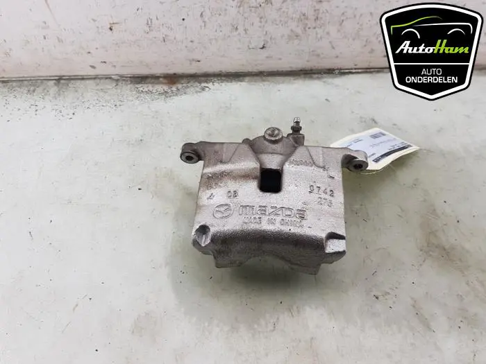 Remklauw (Tang) links-voor Mazda 3.